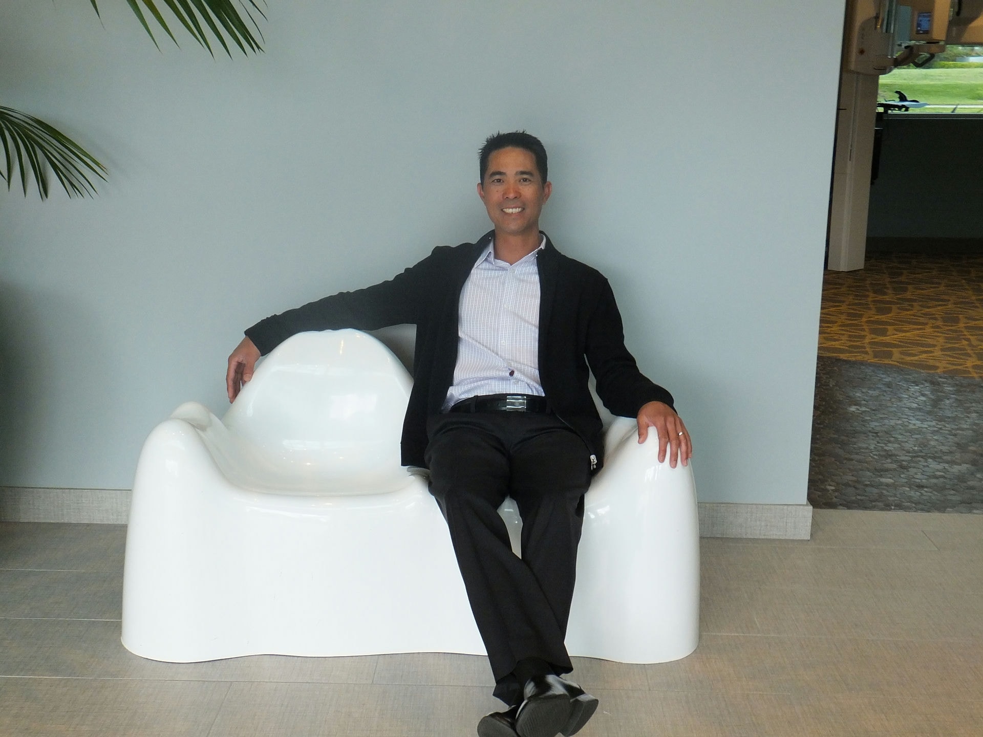 Benco Dental Territory Representative Lan Phi at one with CenterPoint West's molar-inspired chair.