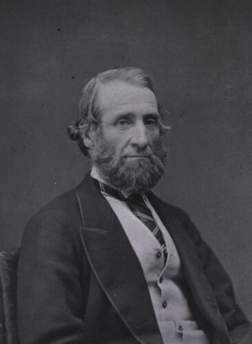 A portrait photograph of Sir John Tomes.
