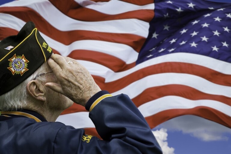 Veteran saluting the U.S. flag