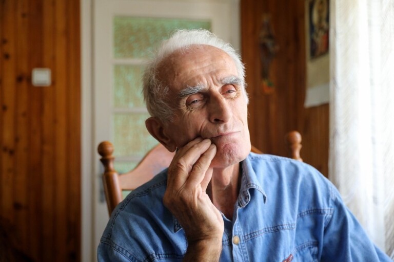 Elderly Man holding cheek - Medicare-expansion-dental- ADA -The-Daily-FLoss