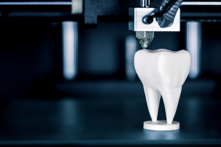 A 3D printer creates a model of a tooth